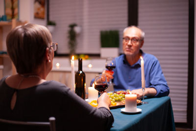 Portrait of smiling friends having food at restaurant