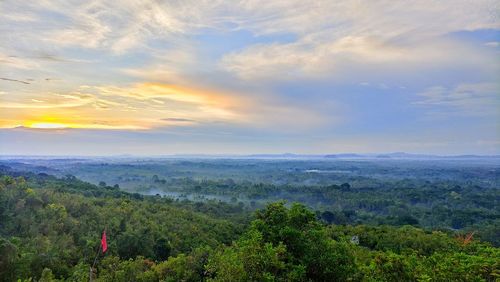 Scenic view of landscape against sky during sunset