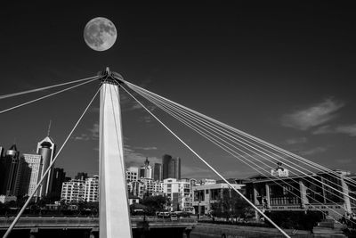 Low angle view of bridge against sky at night