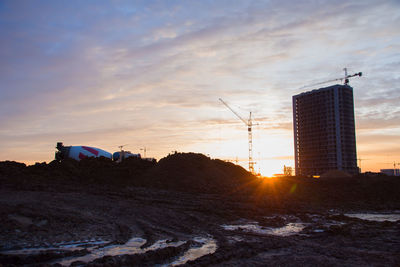 Buildings against sky during sunset