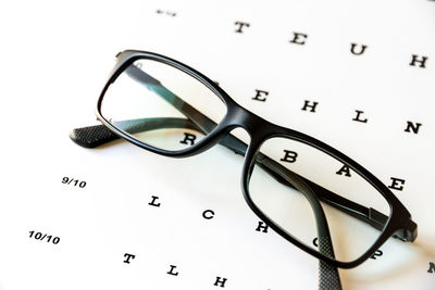 High angle view of eyeglasses on white background