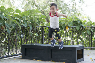 Full length of boy playing in park