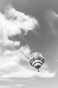 Low angle view of hot air balloon flying against sky