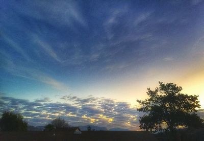 Scenic view of landscape against cloudy sky