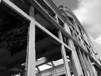 Low angle view of abandoned building against sky