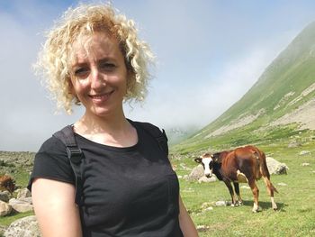 Portrait of smiling young woman with horse