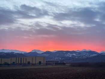 Scenic view of field against sky during sunset