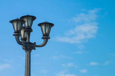 Low angle view of gas light against sky