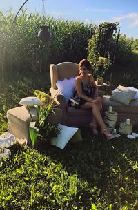 Woman sitting in yard