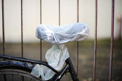 Close-up of bicycle seat covered with plastic