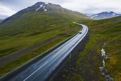 Scenic view of mountain road against sky