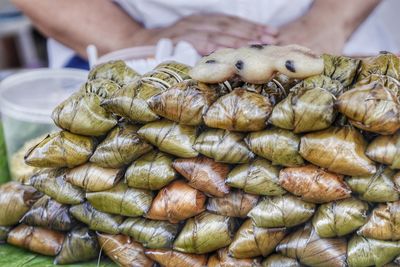 Midsection of man preparing food