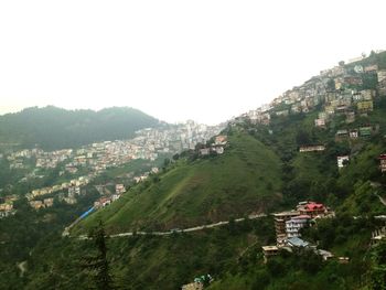 Scenic view of town against clear sky