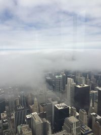 High angle view of buildings in city against sky