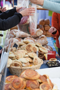 Midsection of person for sale at market stall