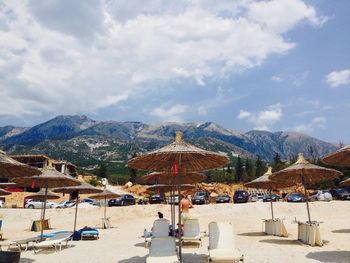 Sunshades and chairs on beach