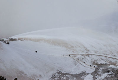 Scenic view of snow covered mountain against sky