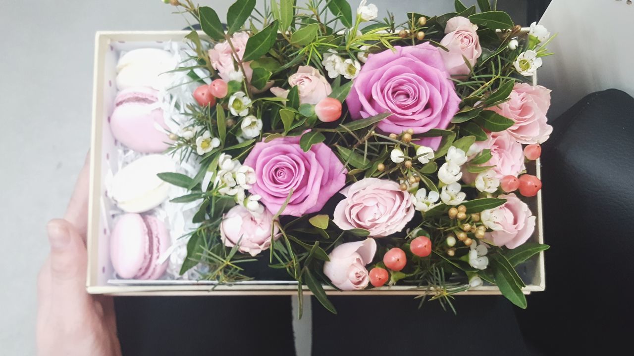 flower, flowering plant, plant, beauty in nature, flower arrangement, pink color, flower head, rose, freshness, rose - flower, bouquet, vulnerability, fragility, nature, indoors, petal, inflorescence, close-up, one person, arrangement, hand, bunch of flowers