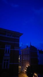 Low angle view of building against sky at night