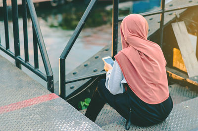 High angle view of man using mobile phone