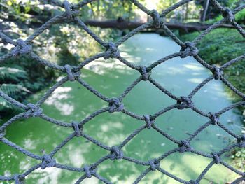 Full frame shot of chainlink fence against sky