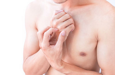 Close-up of hands touching baby