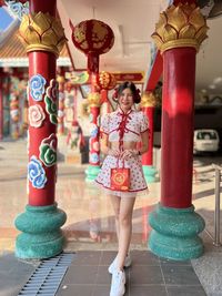 Full length of woman standing on street