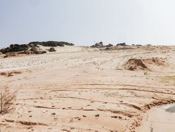 Scenic view of desert against clear sky