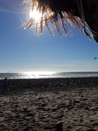 Scenic view of beach against sky during sunset