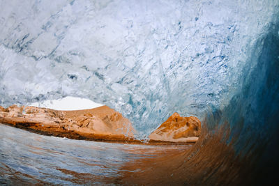 Close-up of glacier on sea shore