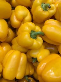 Full frame shot of yellow bell peppers for sale in market