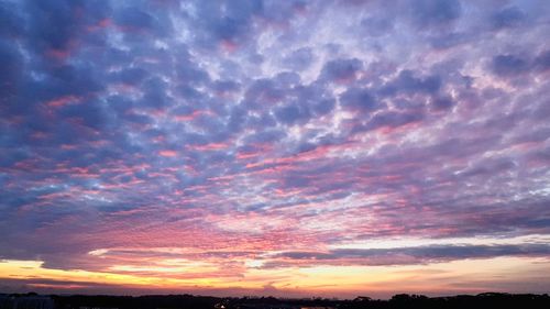 Low angle view of dramatic sky at sunset