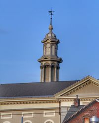 Low angle view of building against clear blue sky