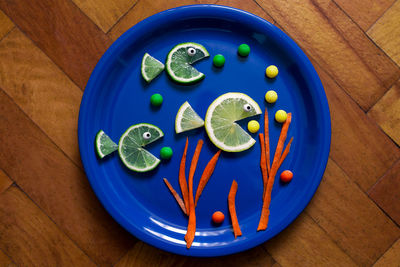High angle view of fruits in plate on table