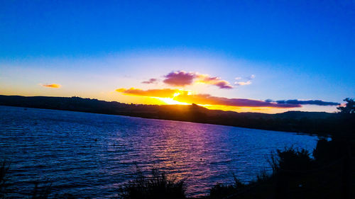 Scenic view of sea against sky during sunset