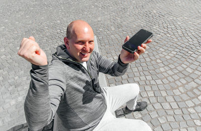 Portrait of a handsome hipster man. a man in a big city with smartphone, a life style concept