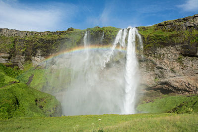 Seljalandsfoss waterfall with a rainbow, iceland