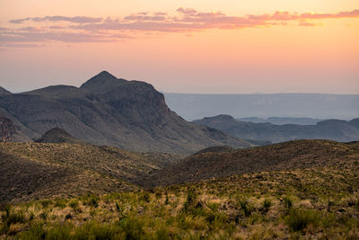 Scenic view of mountains against sky during sunset