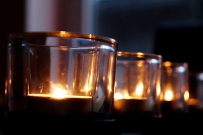 Close-up of tea light candles on table