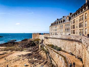 View of beach against blue sky