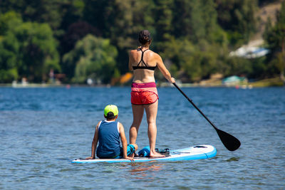 Rear view of men in boat