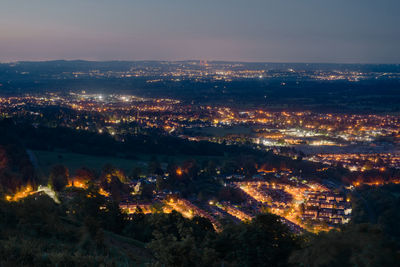 High angle view of illuminated buildings in city against sky