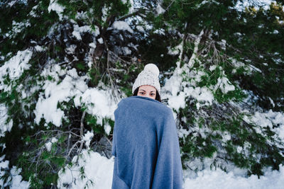 Man on snow covered land