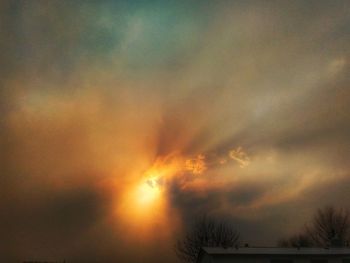 Low angle view of dramatic sky during sunset