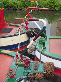 Multi colored rope tied up on metal boat