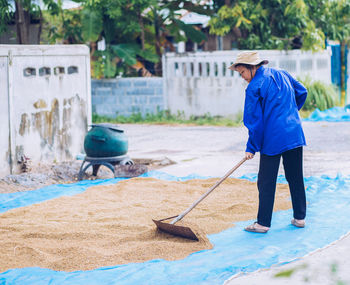 Full length of woman drying crops