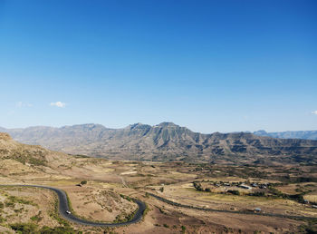 Scenic view of mountains against clear blue sky