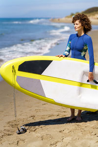 Rear view of man kayaking in sea