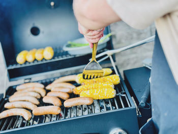 Cropped hand of person preparing food