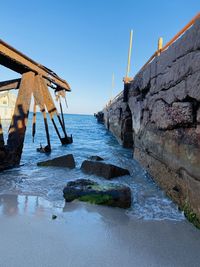 Scenic view of sea against clear blue sky